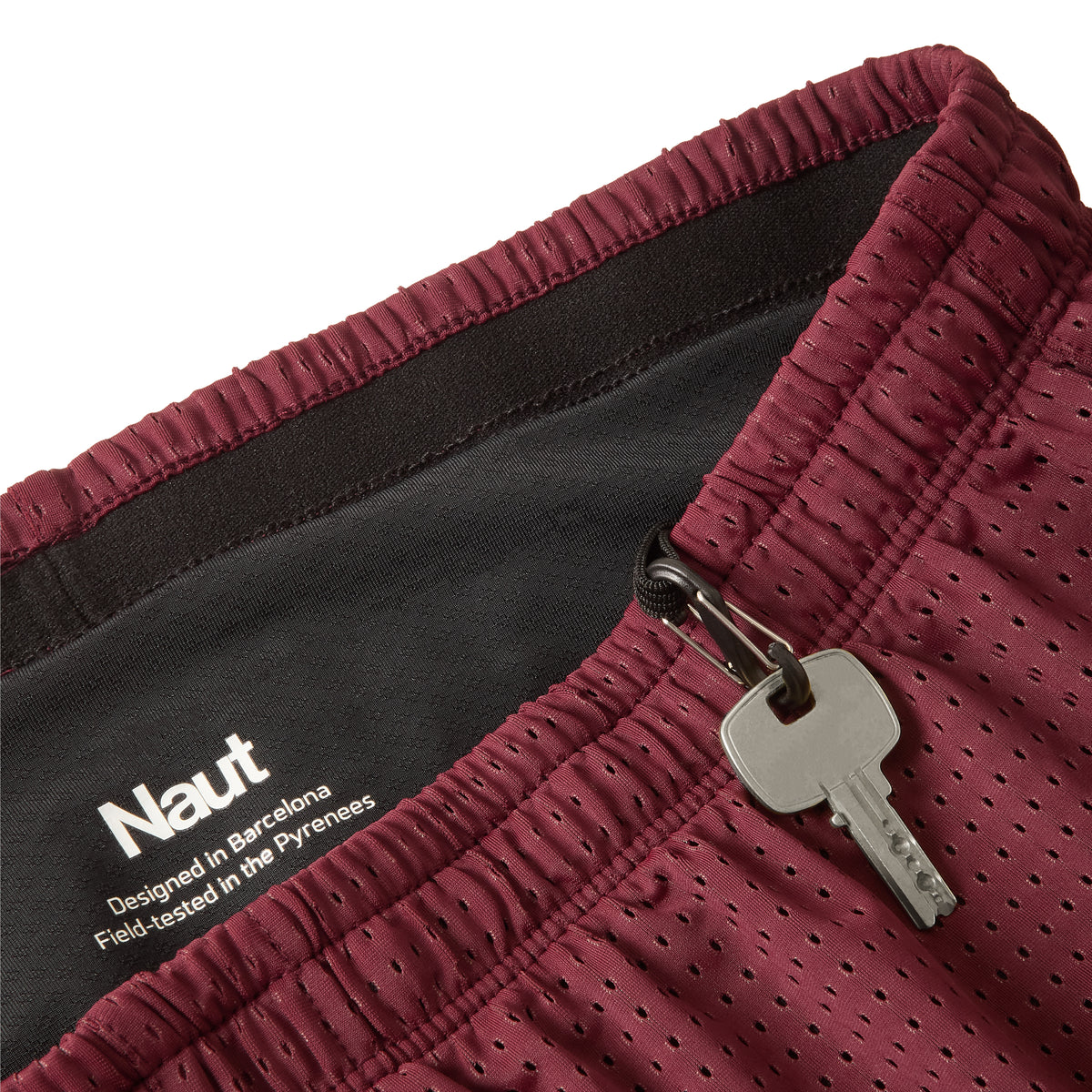 Burgundy | macro2 | Naut Horat 3-inch perforated running shorts for women, close-up detail