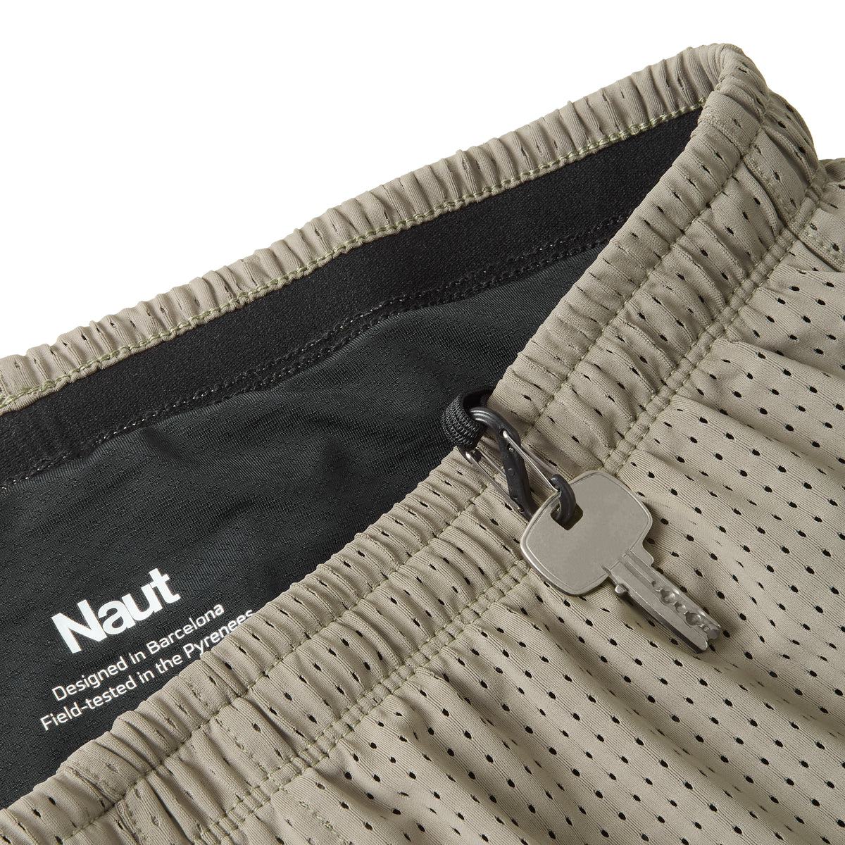 Earth Brown | macro2 | Naut Horat 5-inch perforated running shorts for men, close-up detail